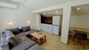 a living room with a couch and a table at Vila Ivica Kjoshe in Ohrid