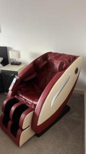 a bed with a comforter on top of it at Modern Apartment near Bullring in Birmingham