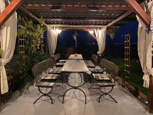 a table set up for a meal on a patio at Casa Genesini in Miercurea-Ciuc