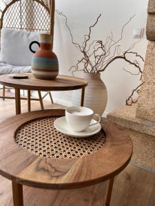 a coffee table with a coffee cup on top of it at Shard Boutique Hotel-adult only in Braşov