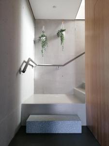 a bathroom with a bath tub and a bench at "Villa Carpe Diem" Country house in Cambarinho