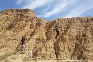 a man and a girl and a dog on a mountain at negev ein habsor עין הבשור דרום in Ein HaBesor +14 photos