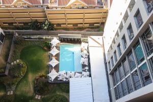 an overhead view of a pool in the middle of a building at Sandton Smart Apartment Eleven in Johannesburg