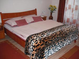 Posteľ alebo postele v izbe v ubytovaní Aba és Andrea Apartmanok