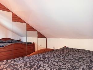 a bedroom with two beds in a attic at Barytowy apartament in Tarnowskie Góry