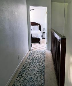 a hallway leading to a bedroom with a bed at Hello Sunshine 321... Lift Off in Titusville