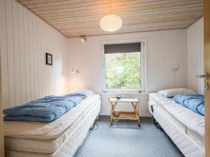 Postel nebo postele na pokoji v ubytování Holiday home Tarm LXXVII