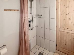 a shower with a glass door in a bathroom at Holiday home Nexø XLI in Neksø