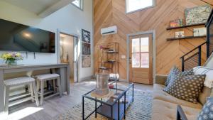 a living room with a couch and a table at A newly built Tiny House in the center of Historic Kennett Square in Kennett Square