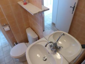 a bathroom with a sink and a toilet at Studio Le Lavandou, 1 pièce, 2 personnes - FR-1-308-161 in Le Lavandou