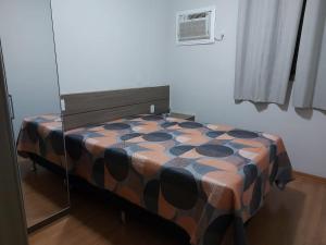 A bed or beds in a room at Apartamento Olimpia - Próximo ao Parque Thermas dos Laranjais - Ideal para familias