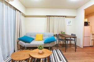 a living room with a couch and a table at HIZ HOTEL - Vacation STAY 08964v in Tokyo