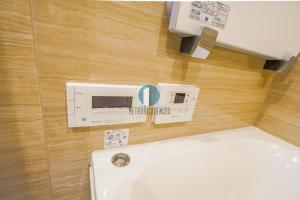 a bathroom with a white toilet in a room at HIZ HOTEL - Vacation STAY 08964v in Tokyo +10 photos