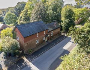 an overhead view of a house with a road at Pear Tree Cottage in Shrewsbury