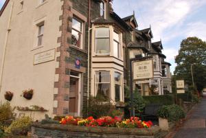 a house with flowers in front of it at Laurel Bank Guest House in Keswick