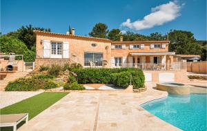 a house with a swimming pool in front of it at Amazing Home In Ste-anastasie-s-issole With Jacuzzi, Wifi And Private Swimming Pool in Sainte-Anastasie-sur-Issole