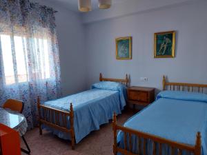 Postel nebo postele na pokoji v ubytování Corazón de Aguilar