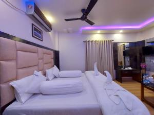 Postel nebo postele na pokoji v ubytování Mohana Beach Resorts Mandarmani