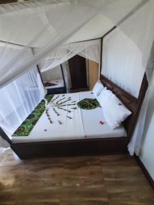 Postel nebo postele na pokoji v ubytování Ondo House