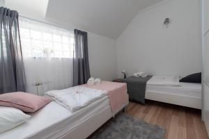 Posteľ alebo postele v izbe v ubytovaní Apartman Lega - Daruvar + 7 fotografií