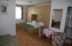 Een bed of bedden in een kamer bij Strandhotel Pichler