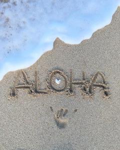 a word written in the sand on a beach at Villa Julius in Gili Trawangan
