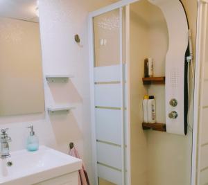 a bathroom with a sink and a mirror at ABA DALÍ in Conil de la Frontera