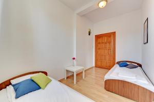 Posteľ alebo postele v izbe v ubytovaní Nice Rooms - Pokoje Gościnne