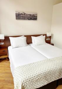 Posteľ alebo postele v izbe v ubytovaní Flores Lofts