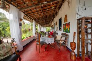 a dining room with a table and chairs at Pousada Le Monte Cristo in Guaramiranga