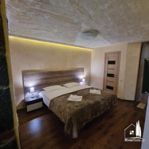 Voodi või voodid majutusasutuse River House Boutique Hotel toas