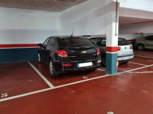 a car parked in a parking garage at 20A01 - Precioso apartamento con piscina y garaje in San Juan de la Arena