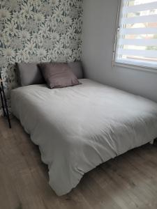Posteľ alebo postele v izbe v ubytovaní Appartement rénové près république