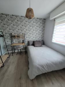 Posteľ alebo postele v izbe v ubytovaní Appartement rénové près république