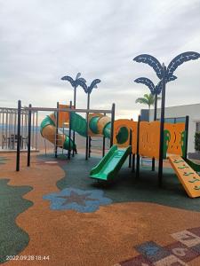 a playground with a slide and a slide at Sri Kejora Vista Bangi Homestay -Studio in Kajang