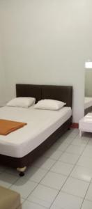 Cama o camas de una habitación en HOTEL MAYA