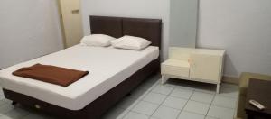 Cama o camas de una habitación en HOTEL MAYA
