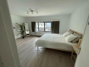 Ένα ή περισσότερα κρεβάτια σε δωμάτιο στο Cosy flat for 4 p. with garden in Tremelo