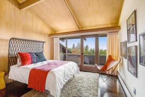 a bedroom with a bed and a large window at Shoreline Sanctuary in Shoreline