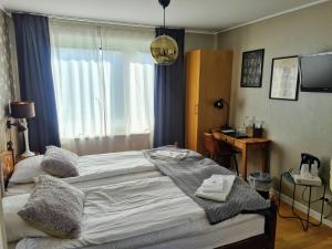 Letto o letti in una camera di Toftastrand Hotell