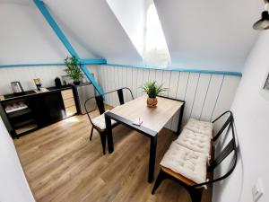 a dining room with a table and chairs at TI CAZ PYRENEES (Chambre d'Hôtes) in Mirepeix +8 photos