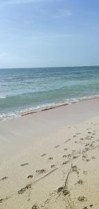 a heart drawn in the sand on the beach at Vee's Villa in Kilifi