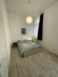 Posteľ alebo postele v izbe v ubytovaní Agréable maison de ville dans la plus belle Avenue