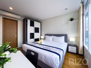 Postel nebo postele na pokoji v ubytování Vortex KLCC Suites by Homestay