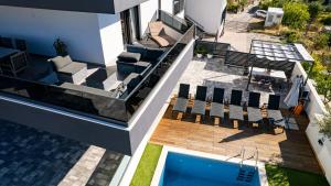 an aerial view of a house with a swimming pool at Villa Porta Salonae in Solin +34 photos