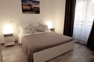 Postel nebo postele na pokoji v ubytování Central Guest House