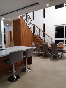 a conference room with a long table and chairs at Das Haus Tagaytay in Tagaytay