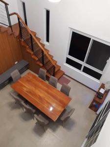 a conference room with a wooden table and chairs at Das Haus Tagaytay in Tagaytay