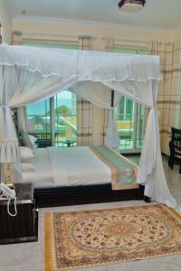 Postel nebo postele na pokoji v ubytování Royal Cliff Zanzibar