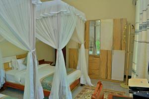 Postel nebo postele na pokoji v ubytování Royal Cliff Zanzibar